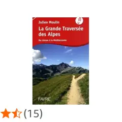 Couverture du livre "La Grande Traversée des Alpes" de Julien Moulin, montrant un sentier de montagne menant à des sommets majestueux sous un ciel bleu.