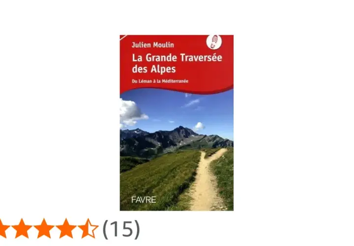 Couverture du livre "La Grande Traversée des Alpes" de Julien Moulin, montrant un sentier de montagne menant à des sommets majestueux sous un ciel bleu.
