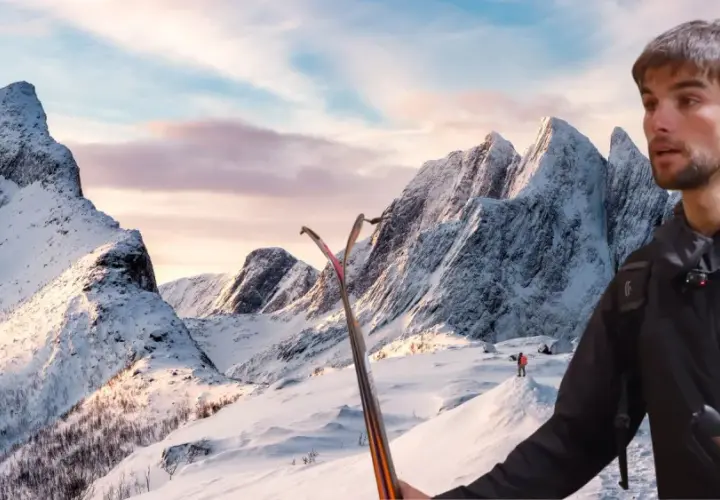 Benjamin Védrines, skieur, se tient prêt à dévaler des montagnes enneigées sous un ciel crépusculaire.