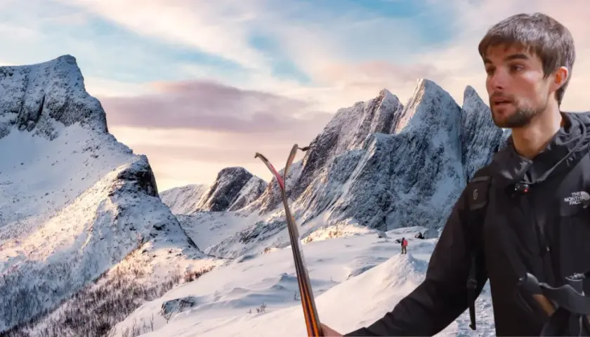 Benjamin Védrines, skieur, se tient prêt à dévaler des montagnes enneigées sous un ciel crépusculaire.