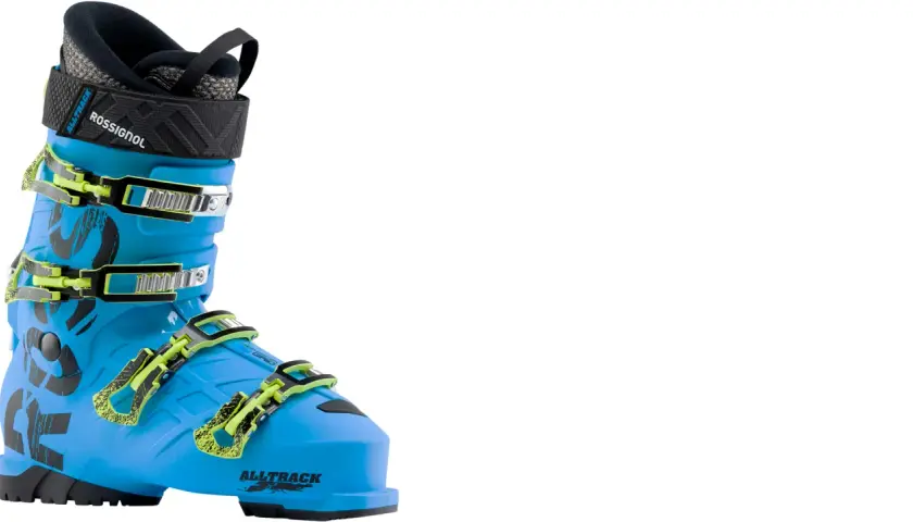 Chaussure de ski Rossignol Alltrack bleue vif, avec boucles vertes fluo. Prête pour dévaler les pistes !